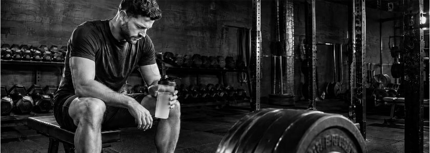 Unbranded gym training scene with weights and a plain shaker bottle