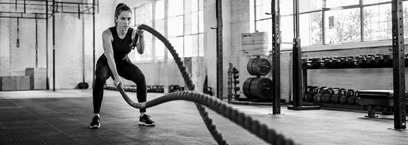 Athlete completing a conditioning workout in a bright unbranded gym