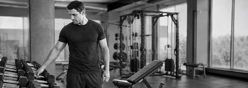 Man preparing to workout in gym